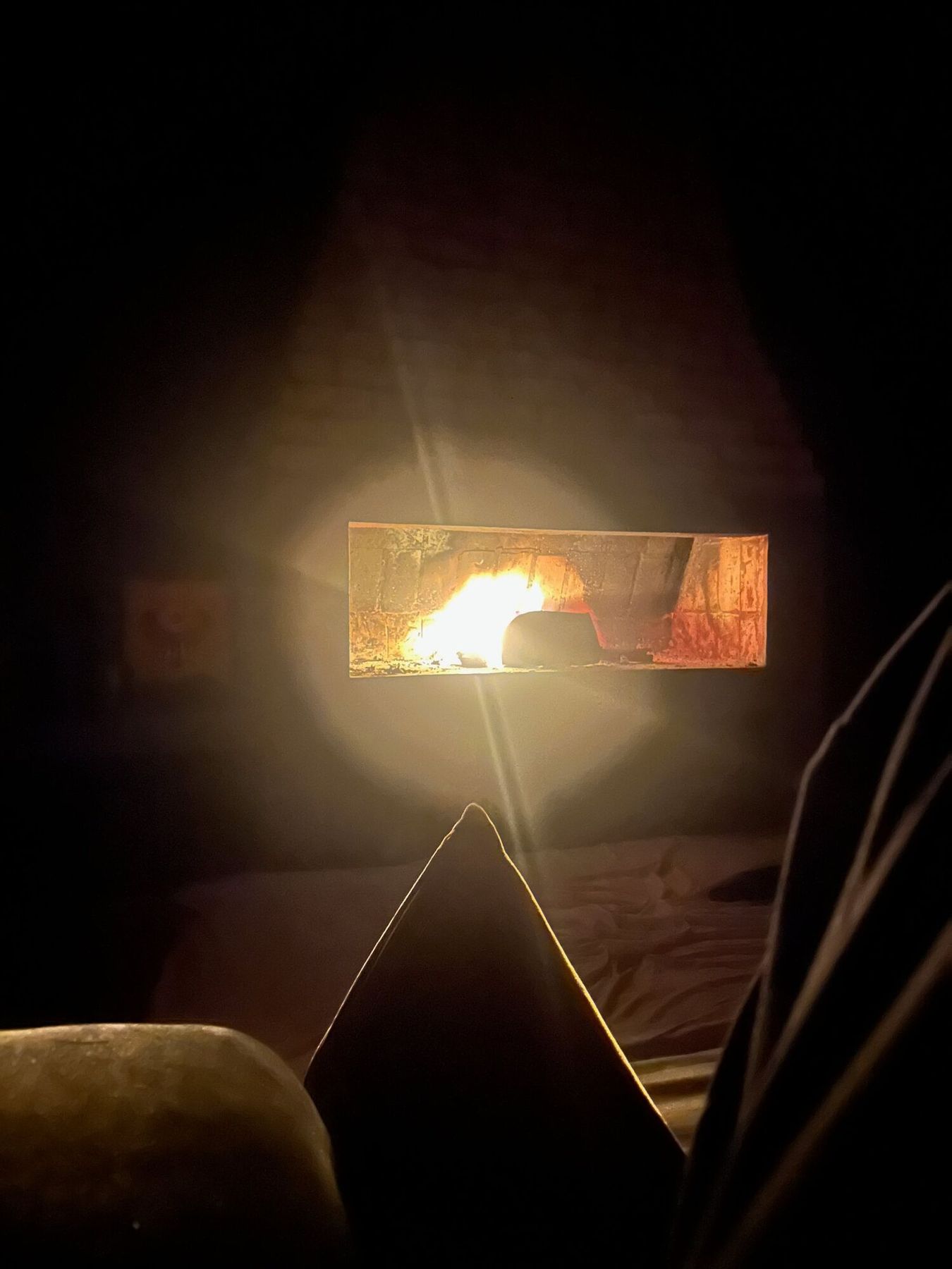 A fire glowing in the hearth