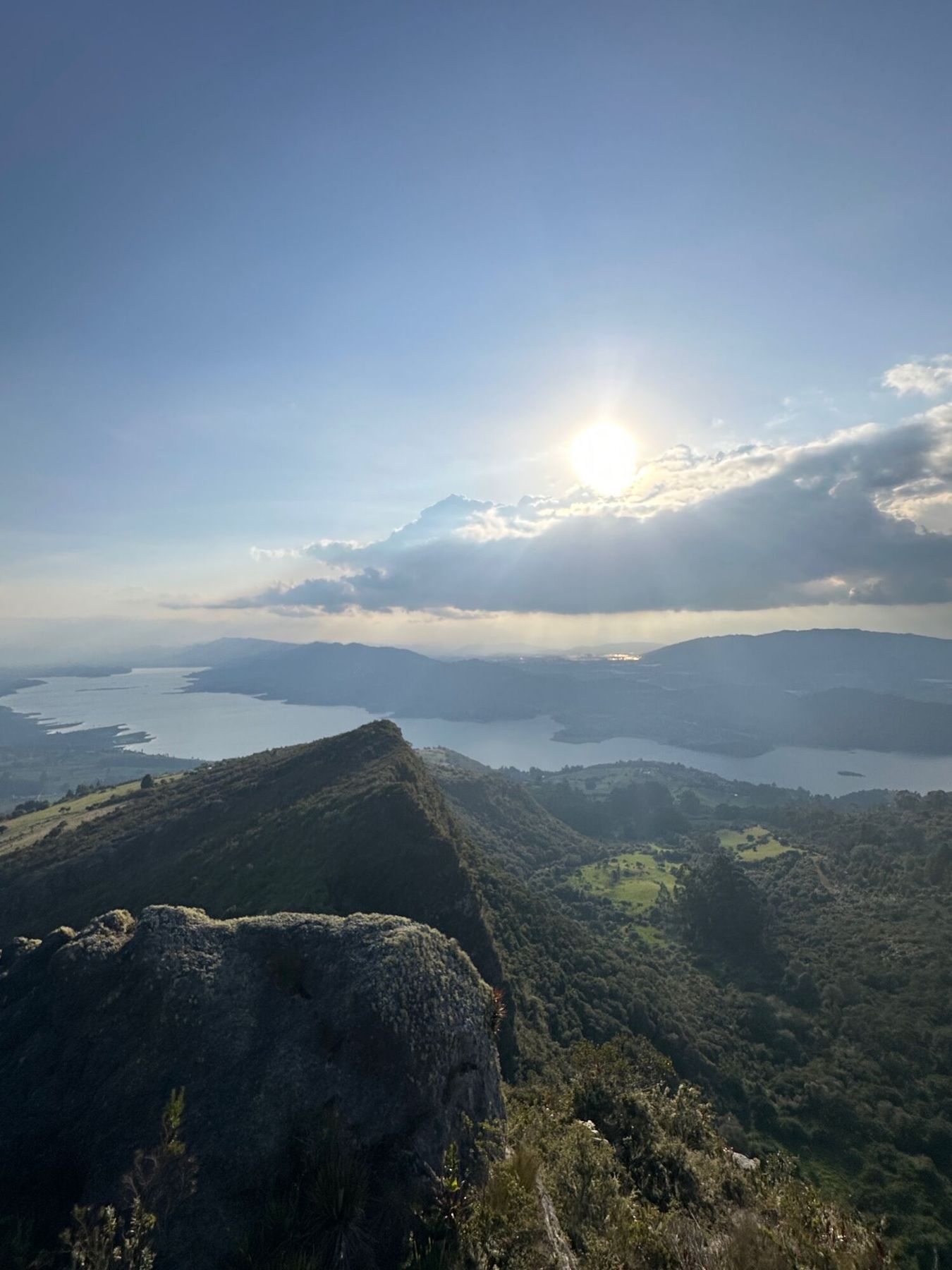 The sun rising over a sea of clouds and the mountain ridge